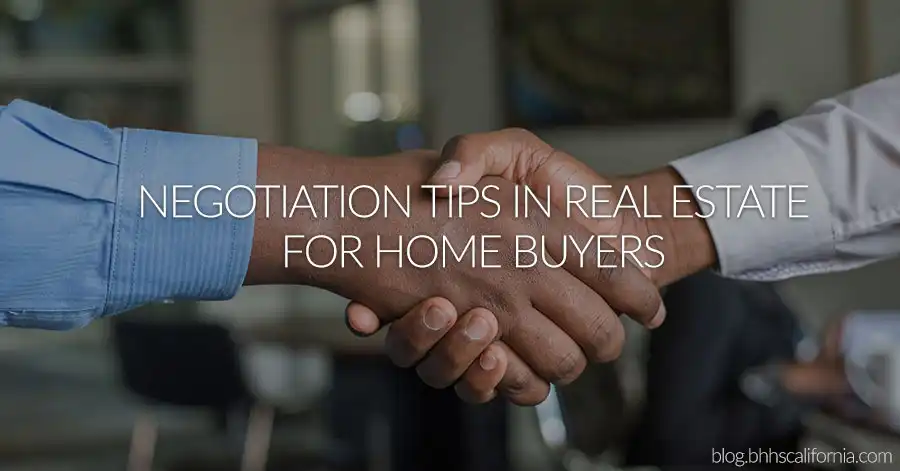 close up of two men's hands shaking and the text: Negotiation Tips in Real Estate for Home Buyers